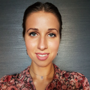 Nora Stern wearing a red and blue floral top
