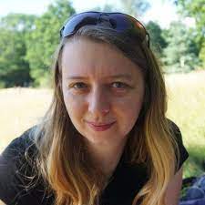 katarzyna stawarz wearing sunglasses on her head and a dark shirt